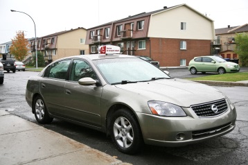 photo of a paratransit taxi car